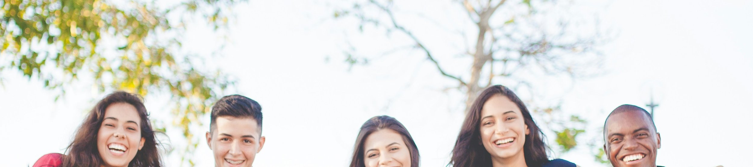 Young adults in conversation outdoors